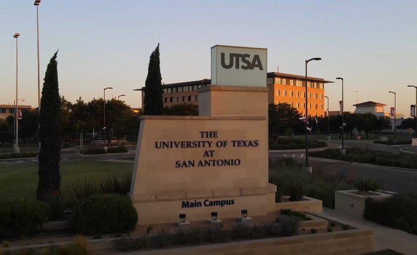 The University of Texas at San Antonio Main Campus sign stands prominently against the backdrop of campus buildings