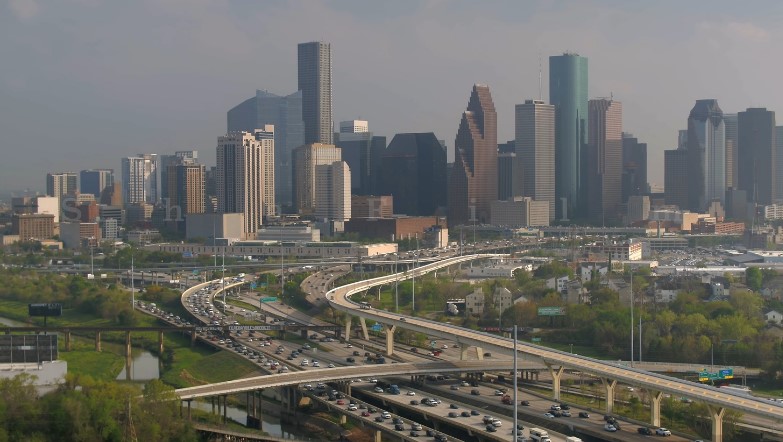 Houston's skyline, a tapestry of steel and glass, rises above a network of highways