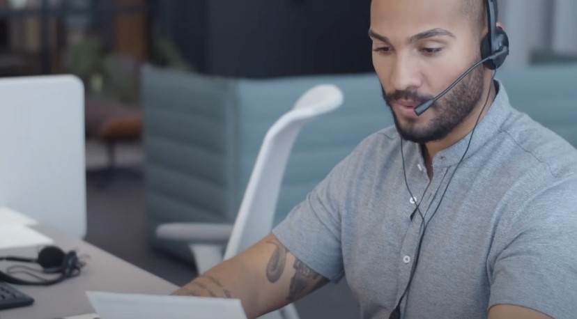 Modern office, a call center professional, engaged in a conversation