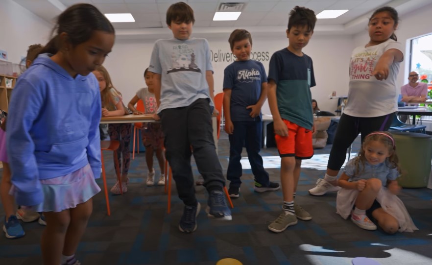 Children engaged in a lively activity, demonstrating teamwork and coordination