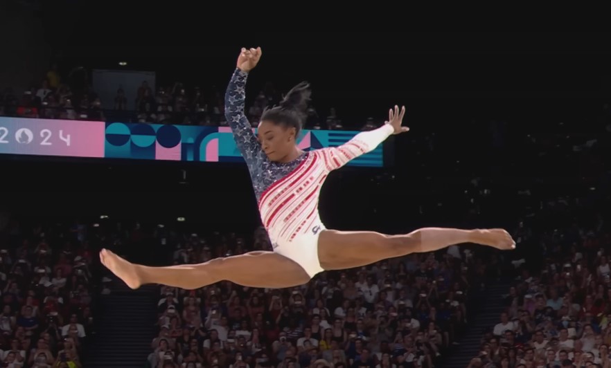 Simone Biles executes a powerful and graceful vault