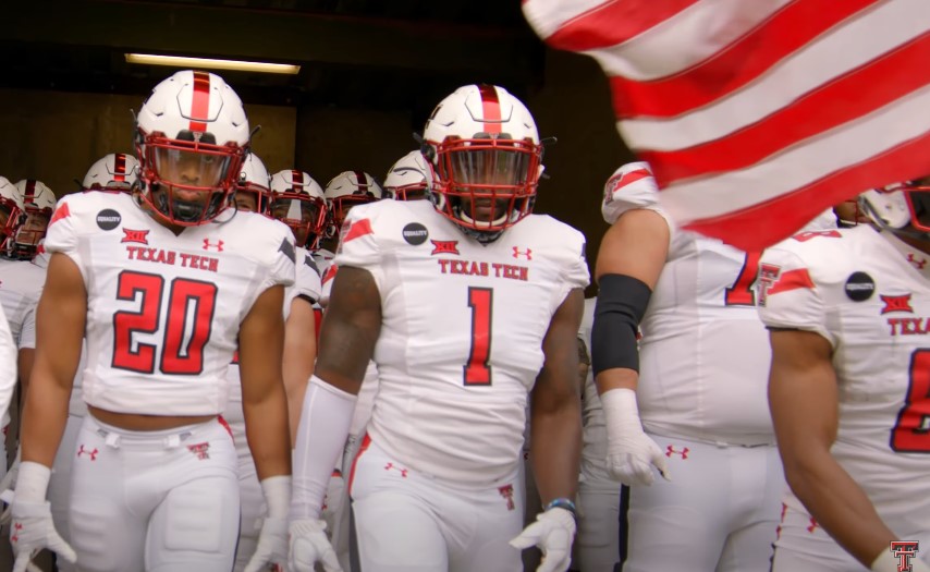 Texas Tech football players entering the pitch