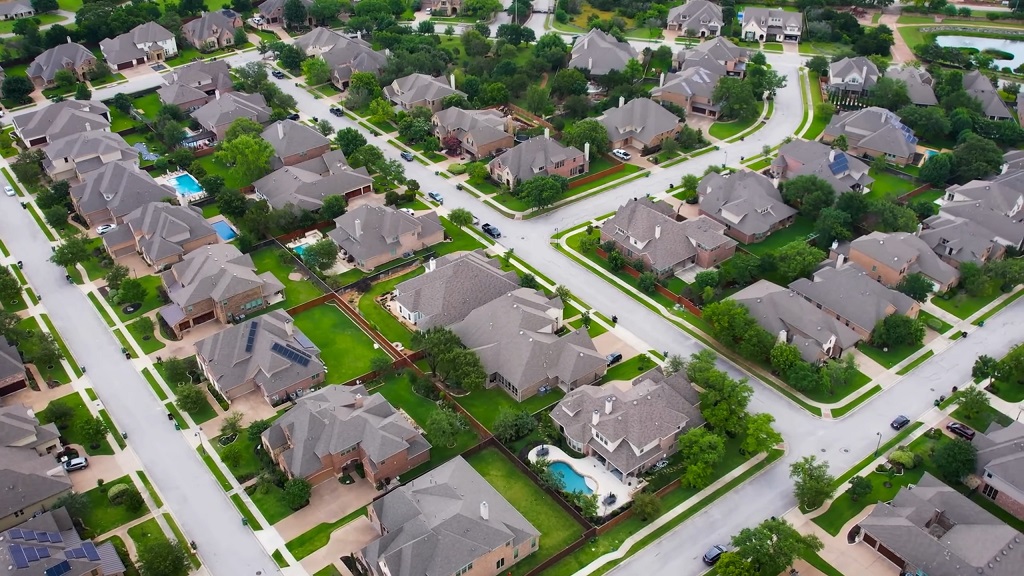 Aerial view of suburban homes showing trends in the housing market