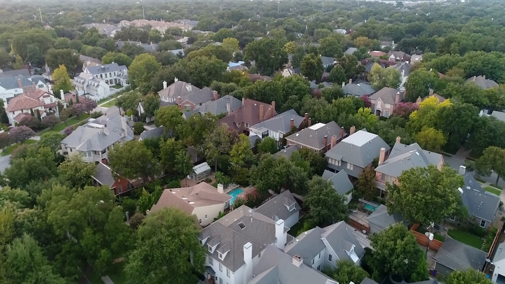 Residential area with dense tree coverage, reflecting housing market variety in suburban communities