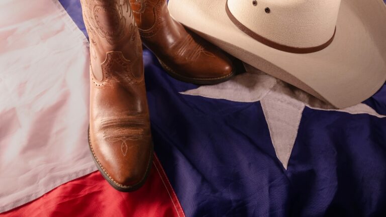 Cowboy boots and a hat on the Texas flag show classic Texas pride