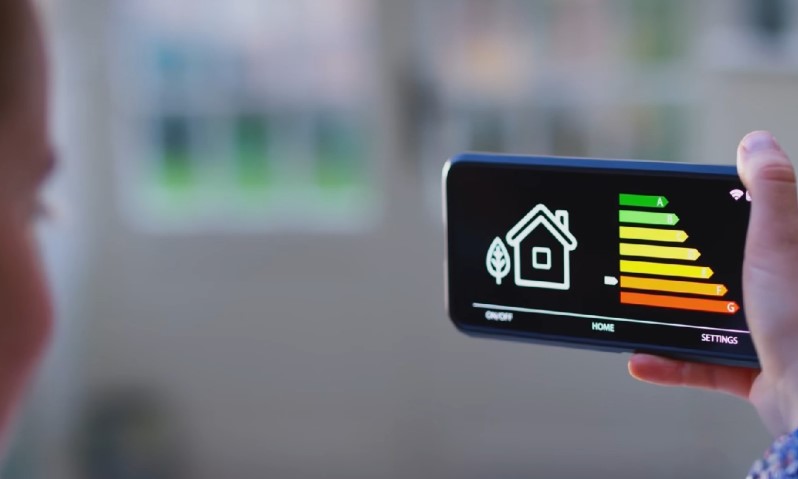 Man managing home's energy efficiency on his phone