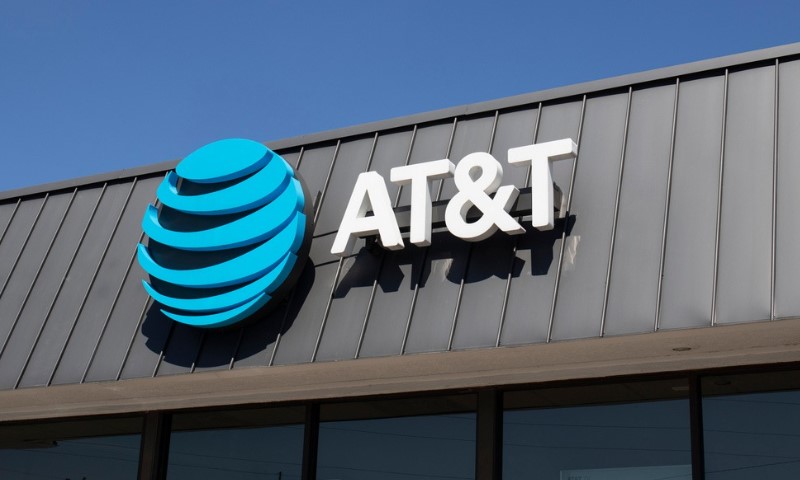AT&T store exterior with a large blue globe logo and bold white lettering on a gray building